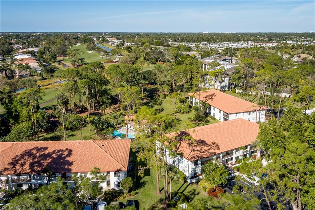 905 Augusta Boulevard, Unit 7 Naples, FL 34113 - Photo 22 of 42 an aerial view of residential houses with outdoor space