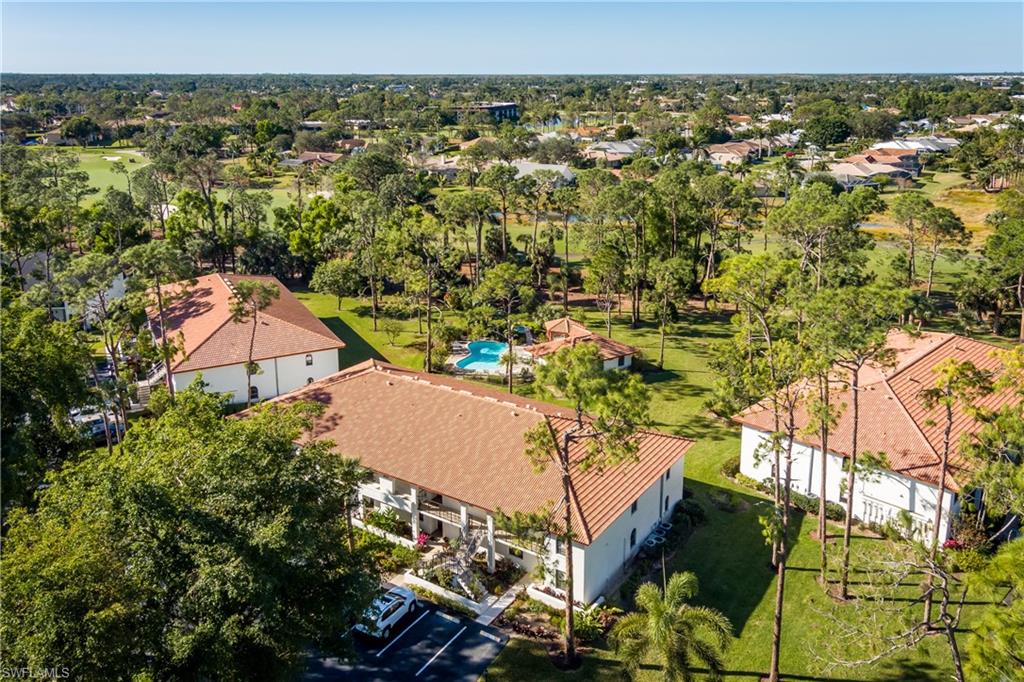 905 Augusta Boulevard, Unit 7 Naples, FL 34113 - Photo 23 of 42 an aerial view of multiple house