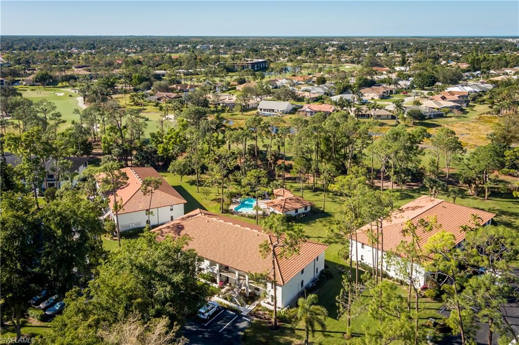 905 Augusta Boulevard, Unit 7 Naples, FL 34113 - Photo 24 of 42 an aerial view of a house with a yard