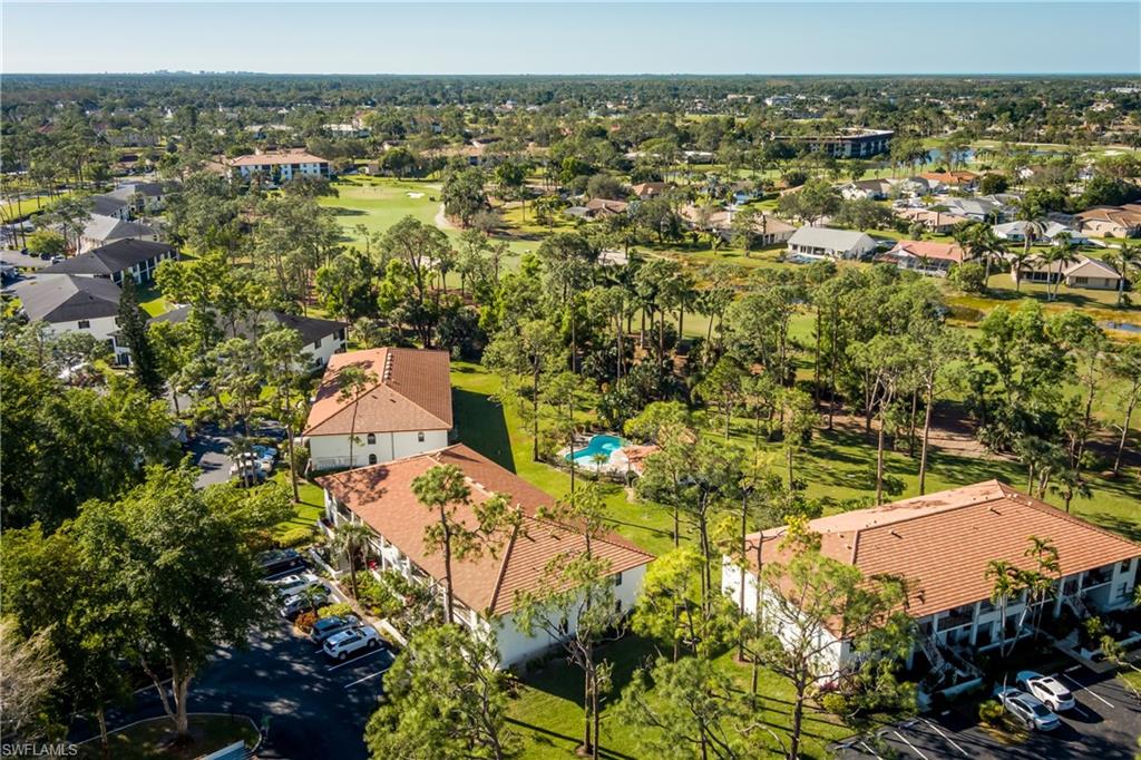 905 Augusta Boulevard, Unit 7 Naples, FL 34113 - Photo 25 of 42 an aerial view of residential houses with outdoor space