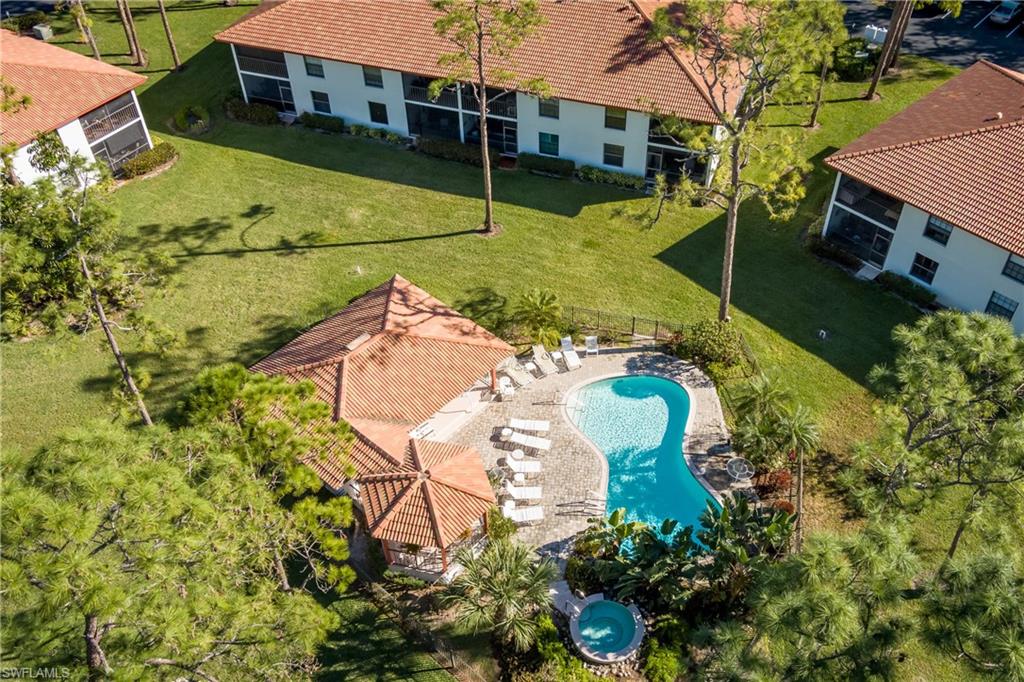 905 Augusta Boulevard, Unit 7 Naples, FL 34113 - Photo 28 of 42 a aerial view of a house with a yard