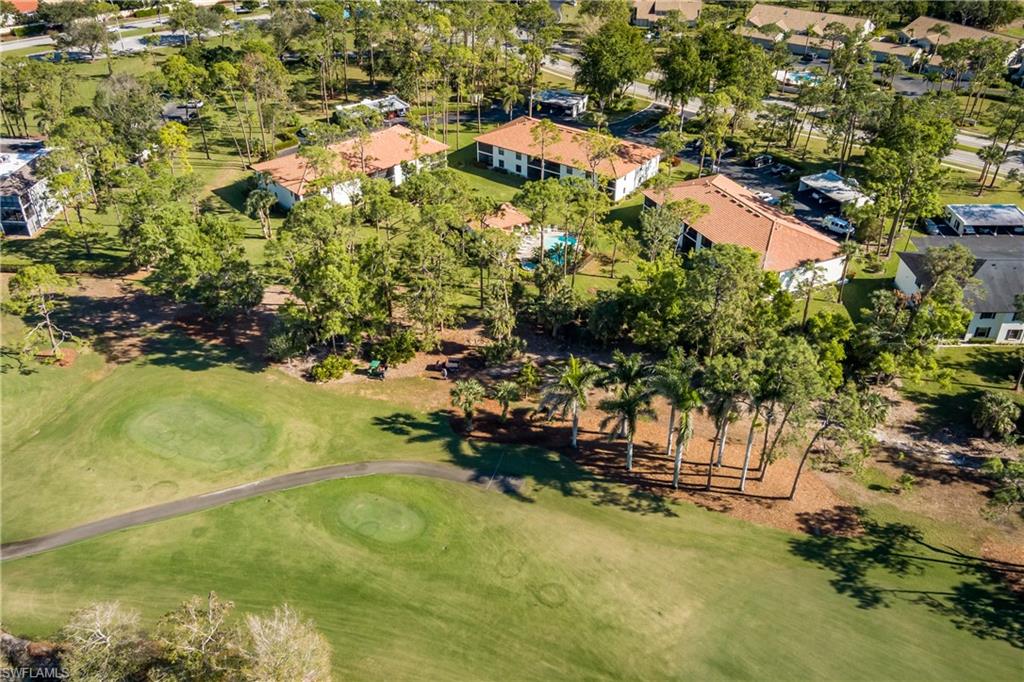 905 Augusta Boulevard, Unit 7 Naples, FL 34113 - Photo 31 of 42 a view of a yard