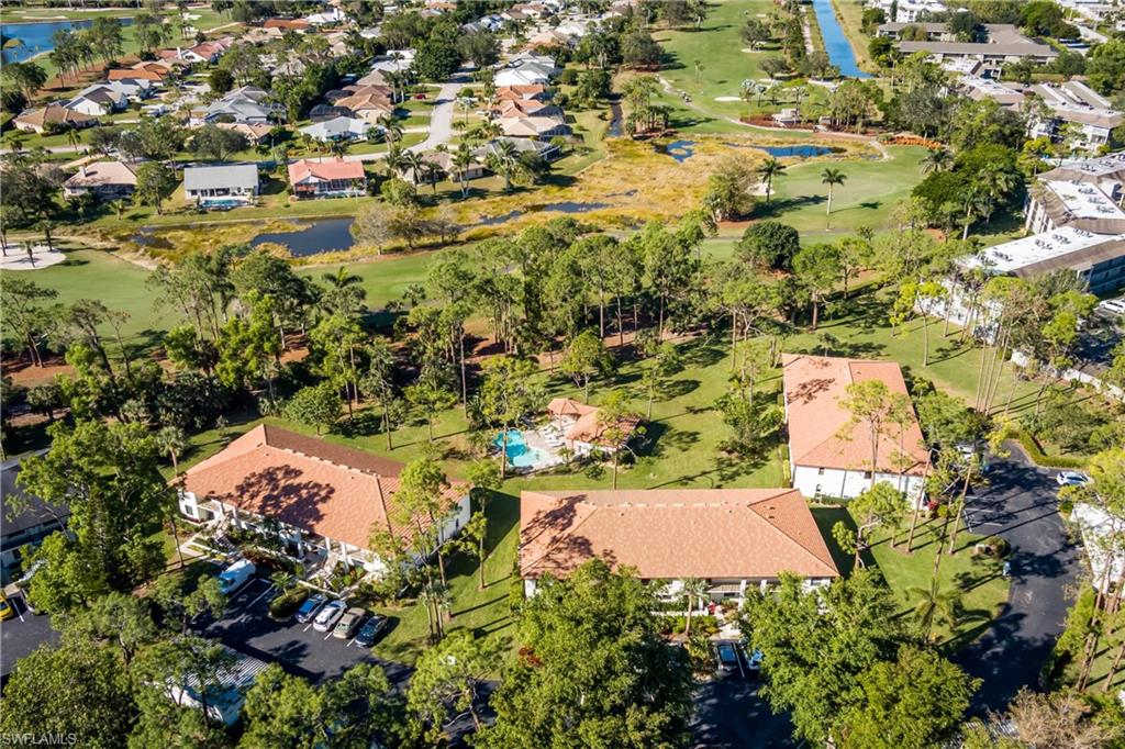905 Augusta Boulevard, Unit 7 Naples, FL 34113 - Photo 34 of 42 an aerial view of residential houses with yard