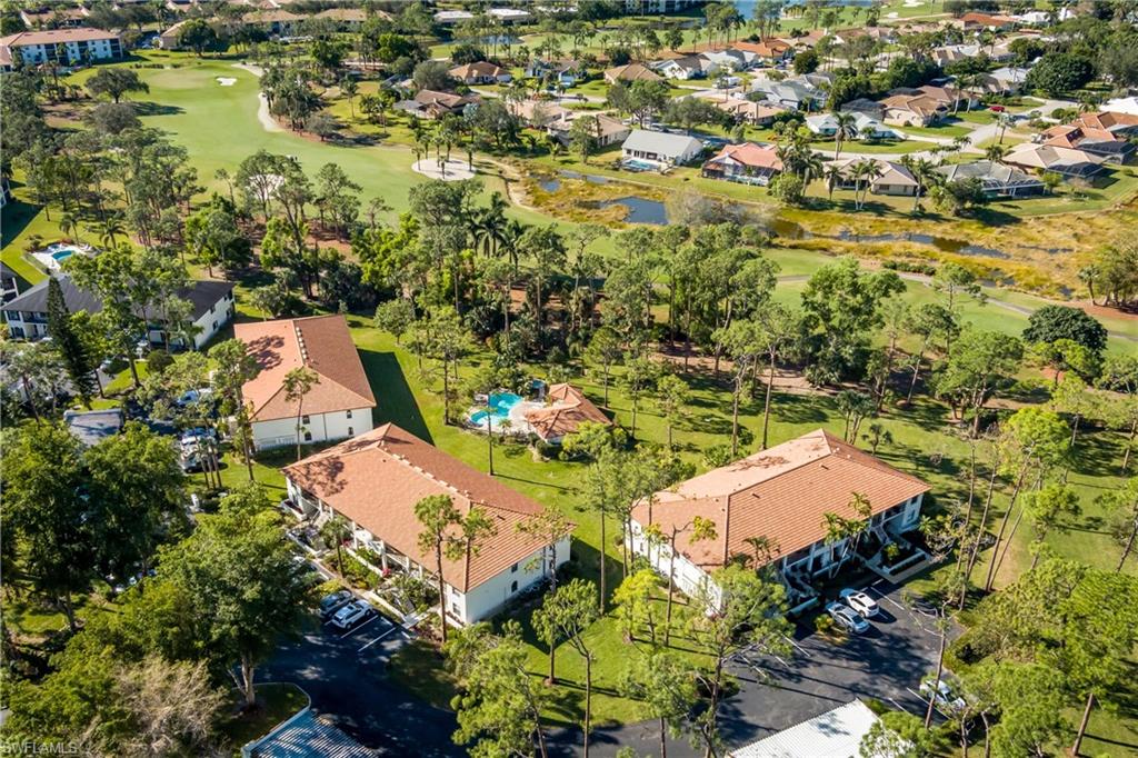 905 Augusta Boulevard, Unit 7 Naples, FL 34113 - Photo 35 of 42 an aerial view of residential houses with outdoor space