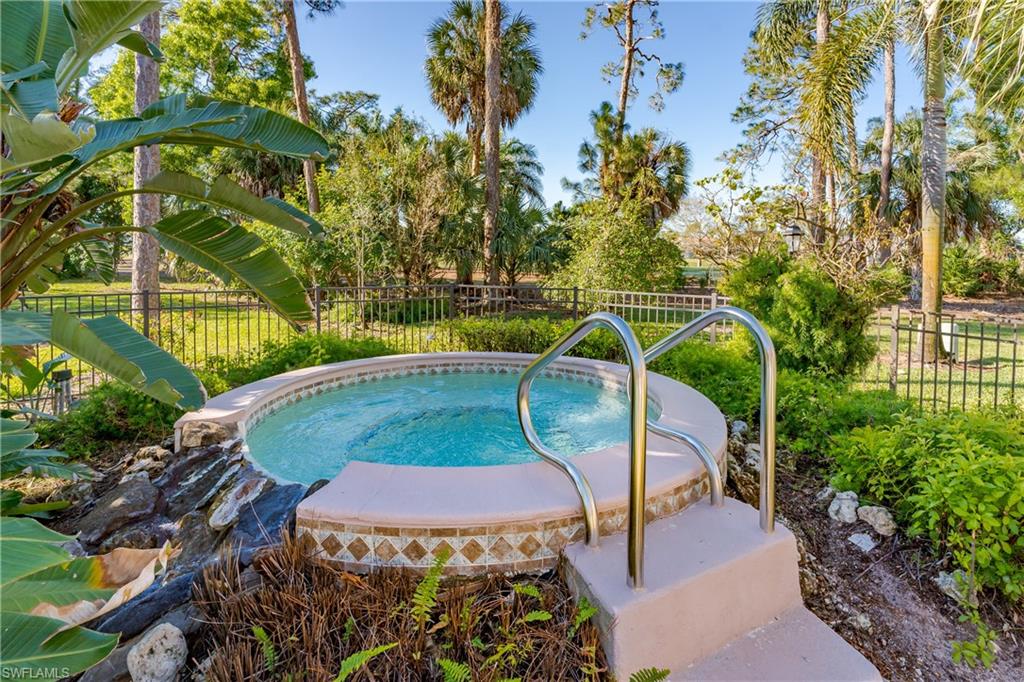 905 Augusta Boulevard, Unit 7 Naples, FL 34113 - Photo 42 of 42 a view of a swimming pool with a patio and plants