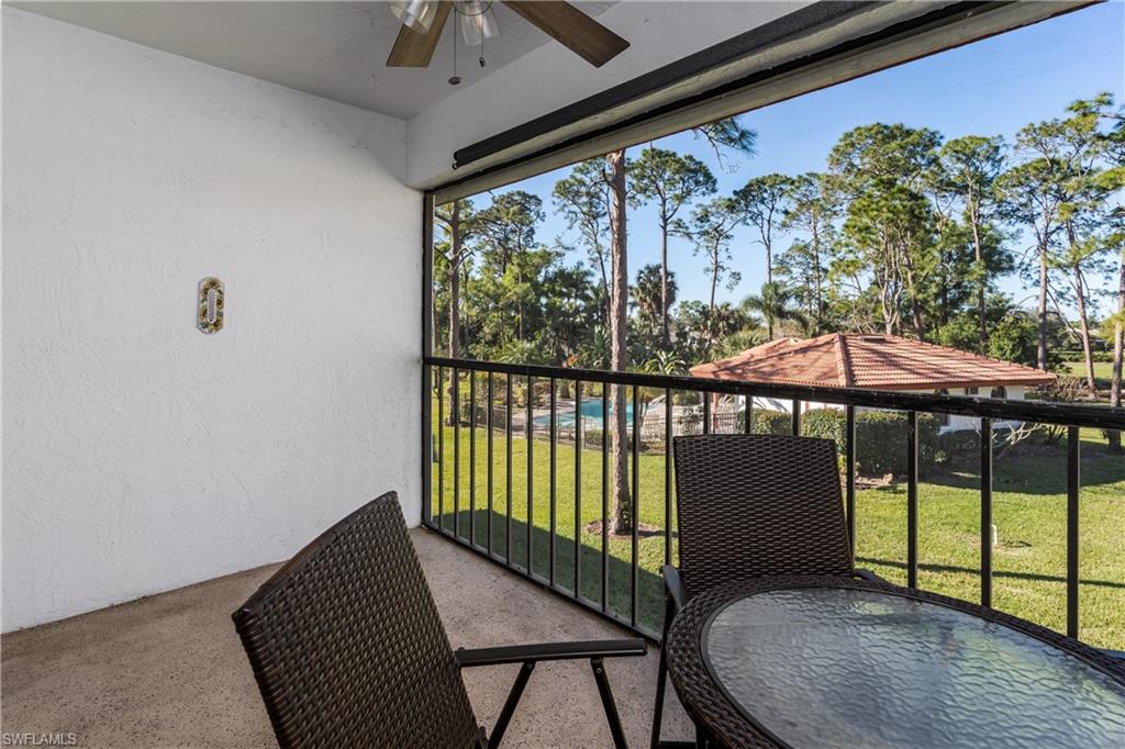 905 Augusta Boulevard, Unit 7 Naples, FL 34113 - Photo 10 of 42 a view of a room with a large window and wooden floor