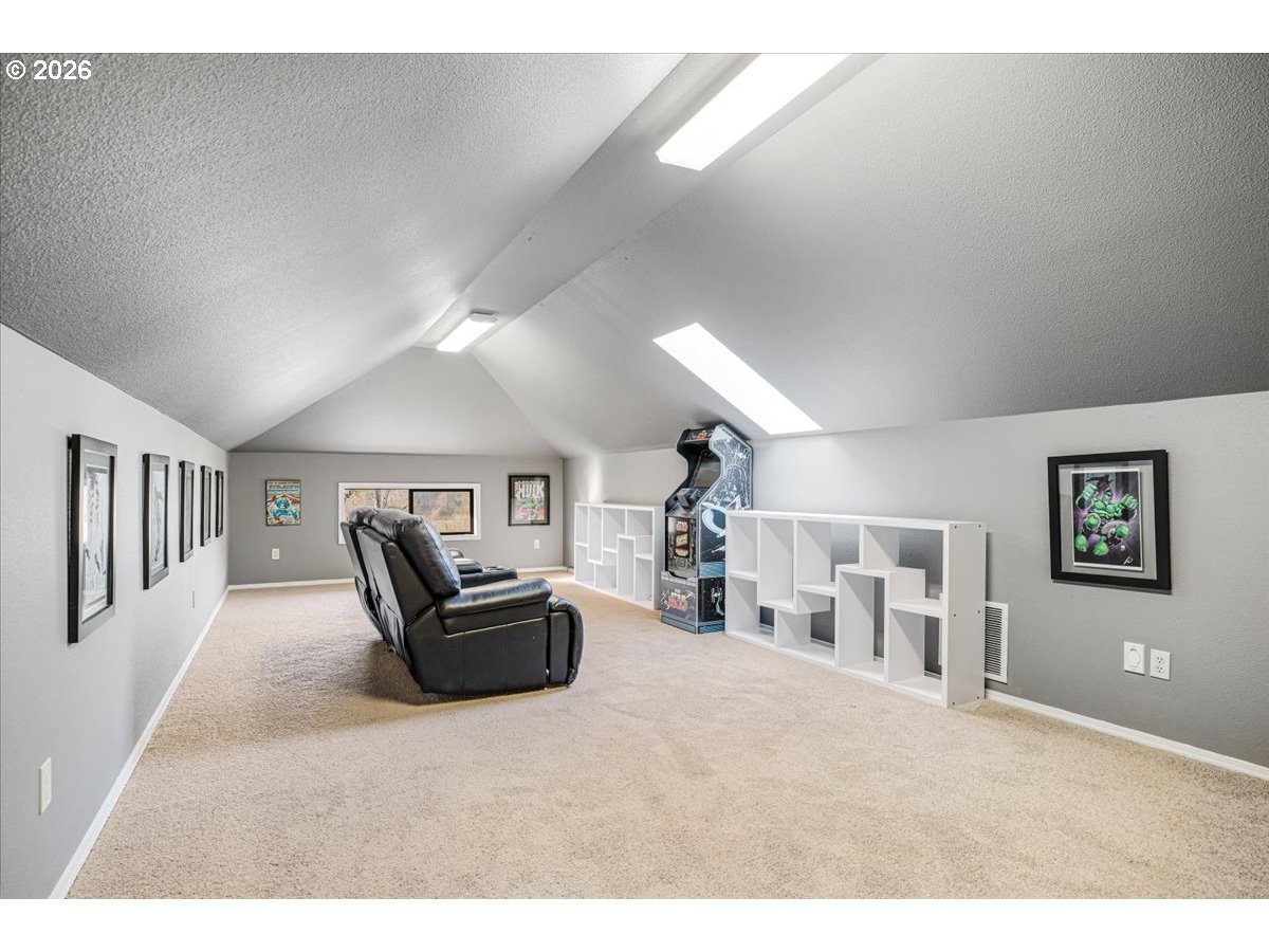 13492 South Warnock Road Oregon City, OR 97045 - Photo 16 of 48 a living room with furniture and a flat screen tv