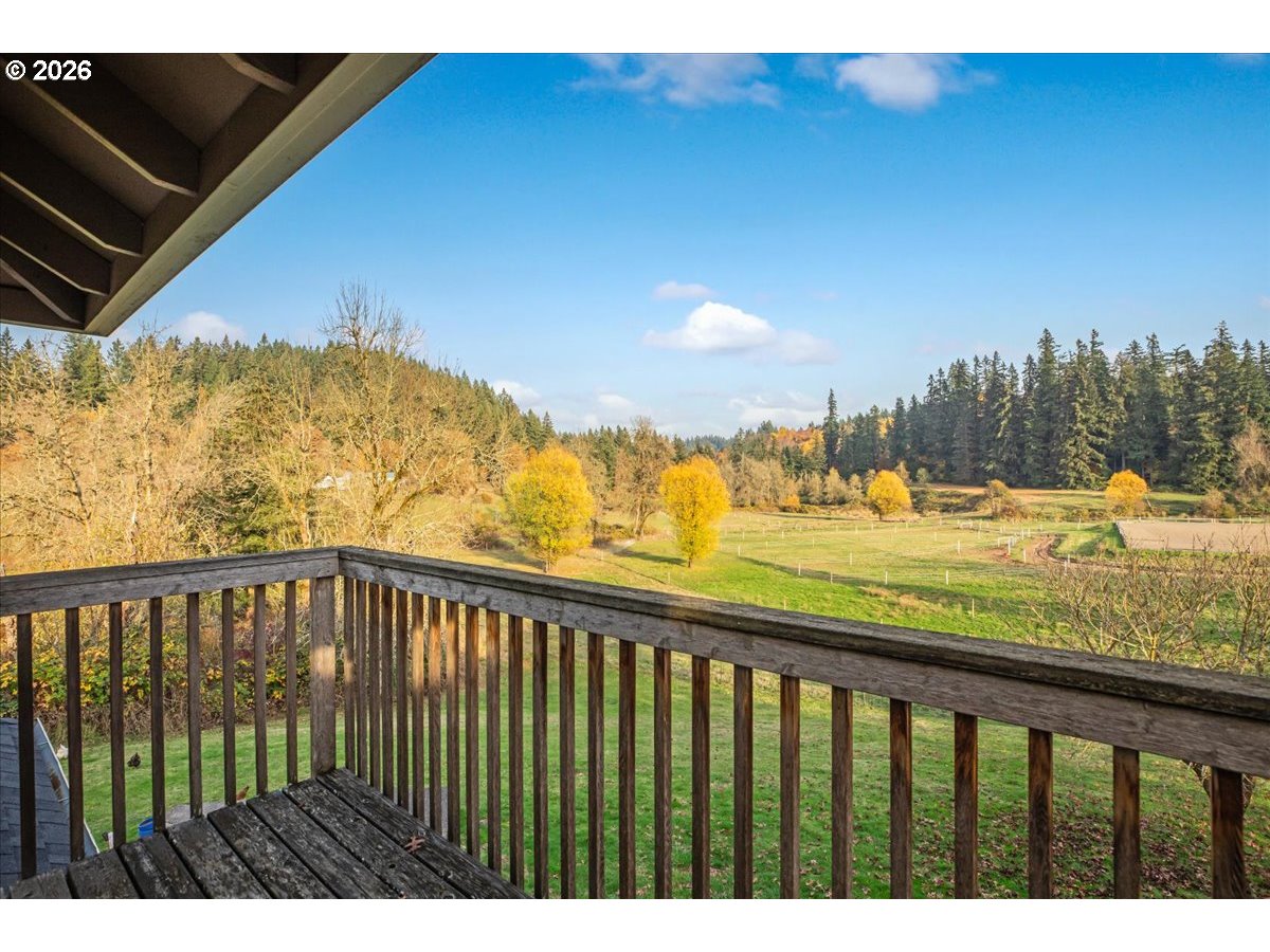 13492 South Warnock Road Oregon City, OR 97045 - Photo 18 of 48 a view of a balcony with an ocean view