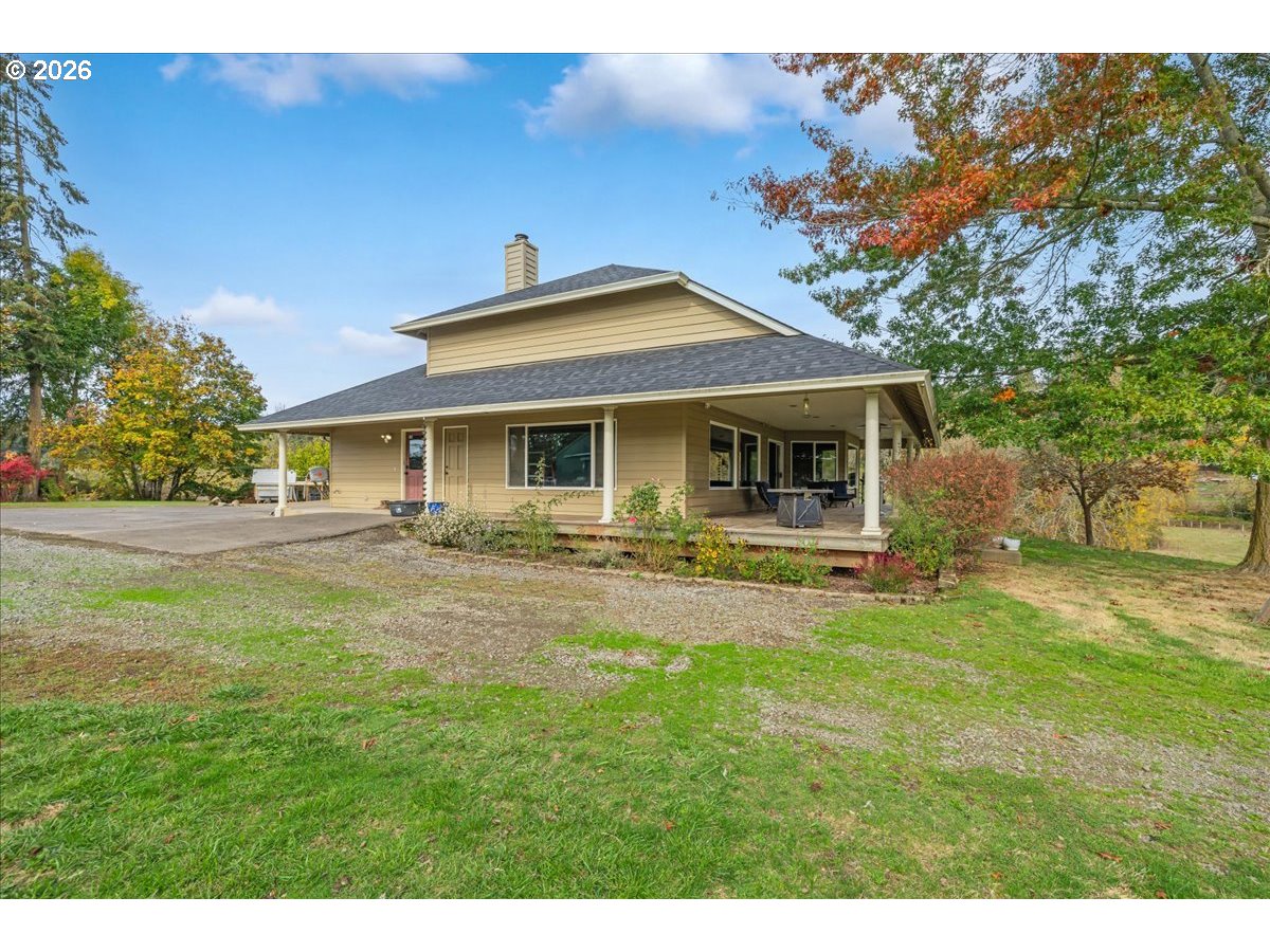 13492 South Warnock Road Oregon City, OR 97045 - Photo 2 of 48 a front view of a house with a yard