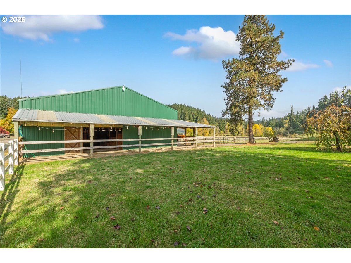 13492 South Warnock Road Oregon City, OR 97045 - Photo 21 of 48 a front view of a house with a garden