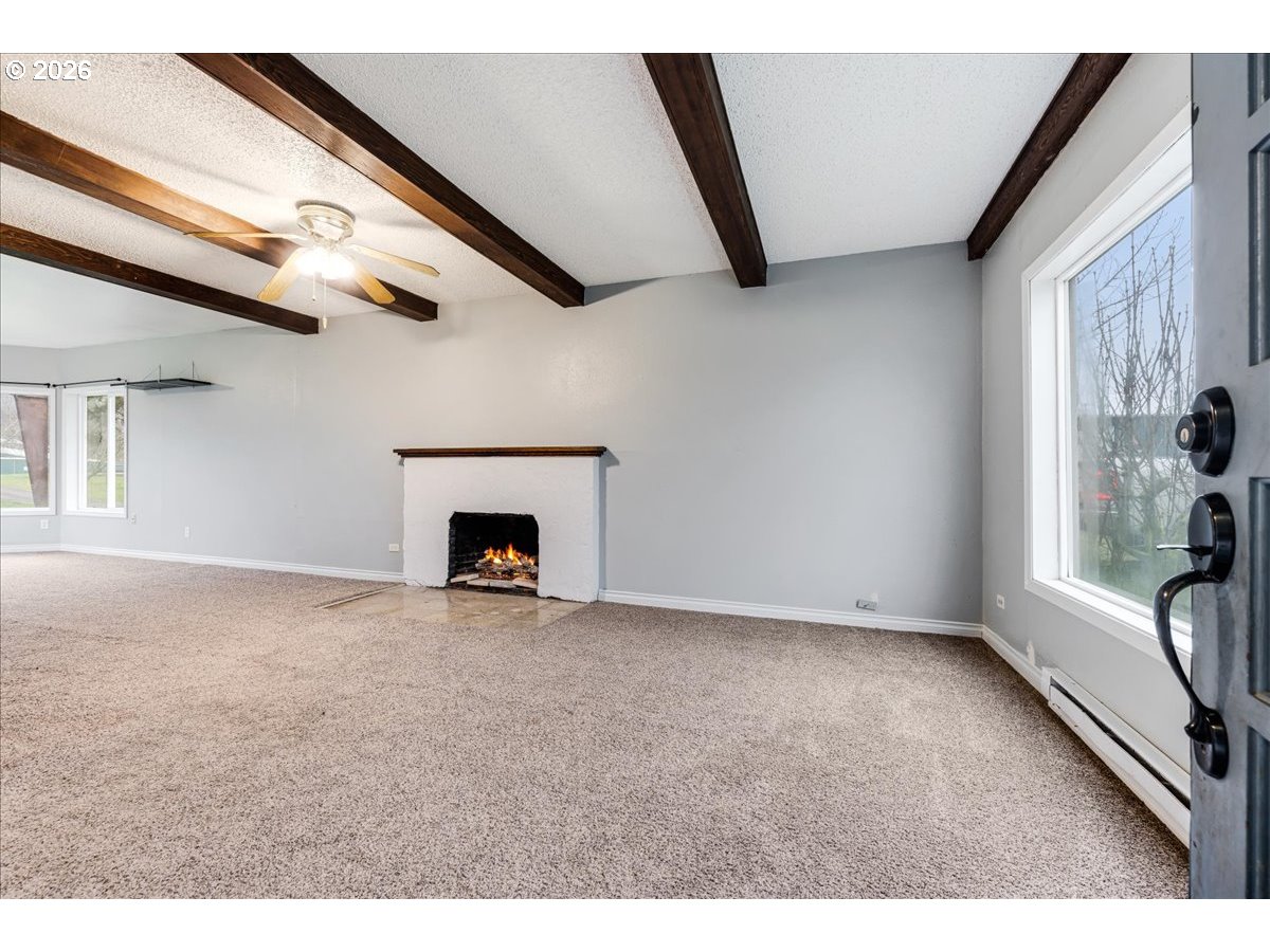 13492 South Warnock Road Oregon City, OR 97045 - Photo 27 of 48 a view of empty room with a fireplace