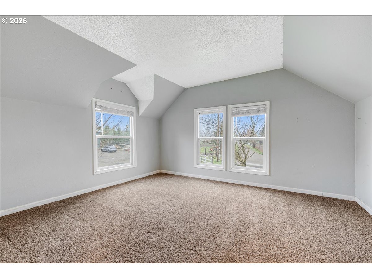 13492 South Warnock Road Oregon City, OR 97045 - Photo 30 of 48 an empty room with windows