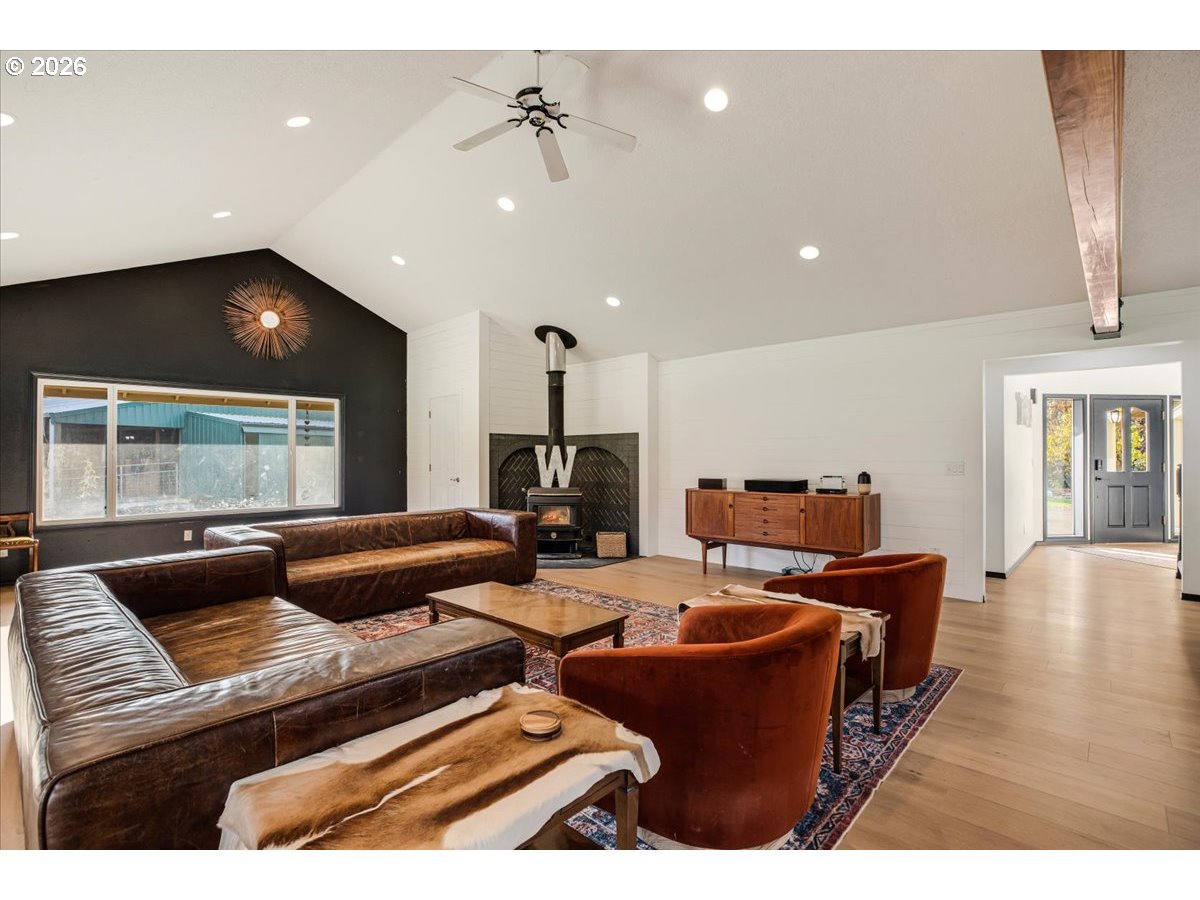 13492 South Warnock Road Oregon City, OR 97045 - Photo 3 of 48 a living room with furniture and wooden floor