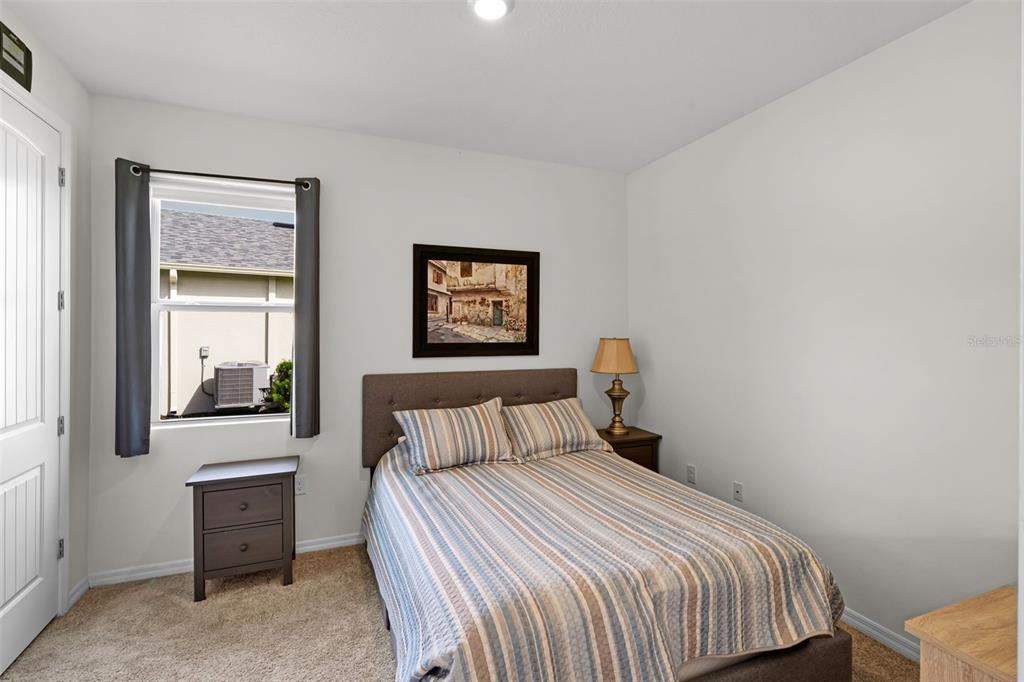 3435 Yellowtop Loop Clermont, FL 34714 - Photo 16 of 42 a bedroom with a bed and window