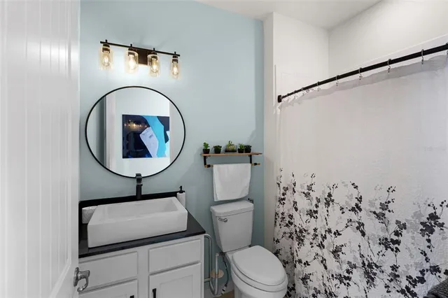 a bathroom with a toilet sink and tub