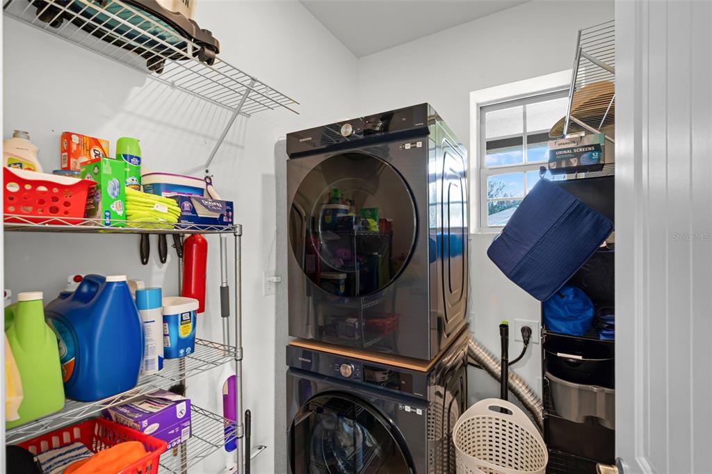 3435 Yellowtop Loop Clermont, FL 34714 - Photo 19 of 42 a utility room with dryer and washer