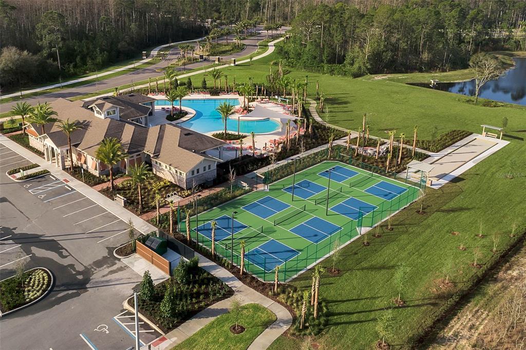 3435 Yellowtop Loop Clermont, FL 34714 - Photo 25 of 42 an aerial view of a house with a garden and swimming pool