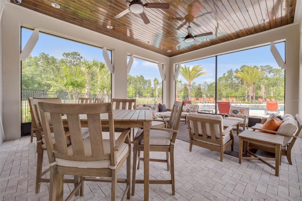 3435 Yellowtop Loop Clermont, FL 34714 - Photo 35 of 42 a view of a dining room with furniture window and outside view