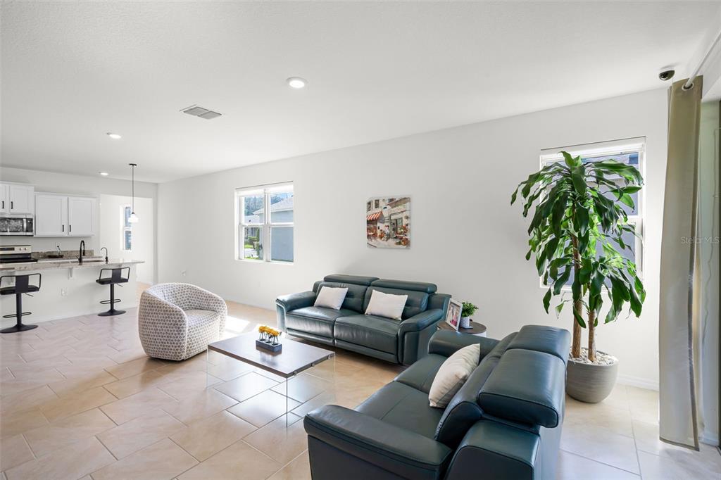 3435 Yellowtop Loop Clermont, FL 34714 - Photo 5 of 42 a living room with furniture and a potted plant
