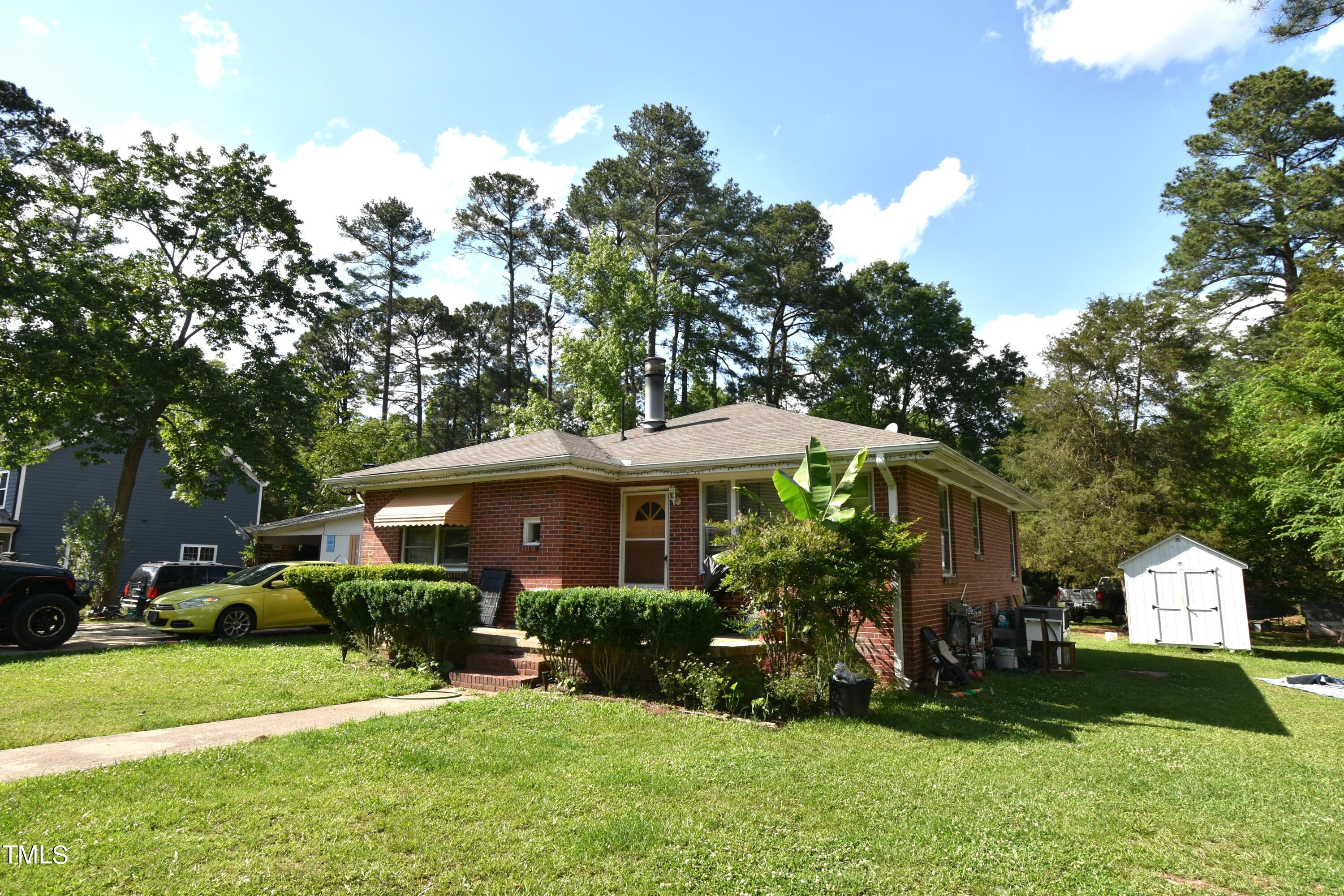 900 Post Avenue Durham, NC 27703 - Photo 4 of 7 a front view of a house with a yard