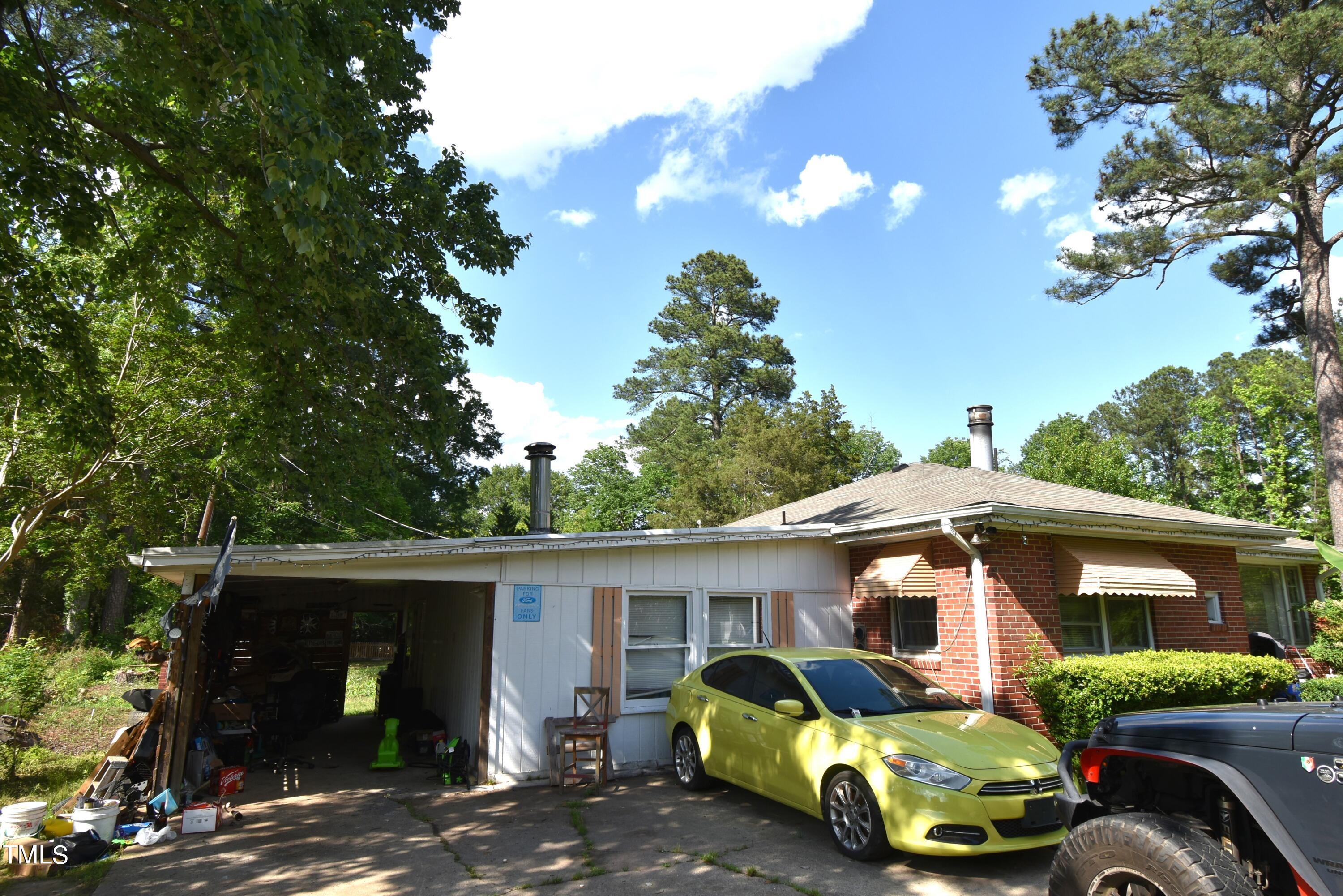 900 Post Avenue Durham, NC 27703 - Photo 6 of 7 a front view of a house with parking space