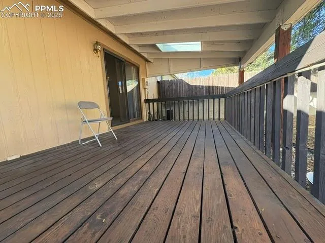 a view of outdoor space with wooden floor