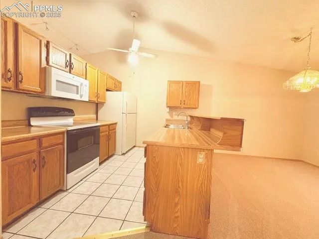 a kitchen with a cabinets and appliances