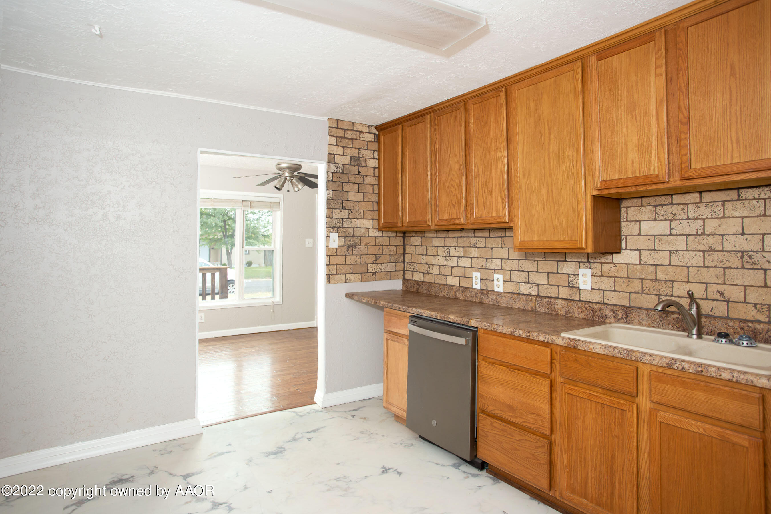 4634 Cline Road Amarillo, TX 79110 - Photo 9 of 26 a kitchen with stainless steel appliances granite countertop a sink stove and cabinets