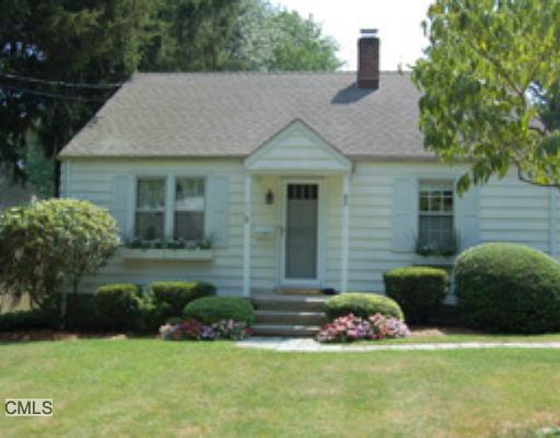 65 Spinning Wheel Road Fairfield, CT 06824 - Photo 1 of 1 a view of house with backyard and garden