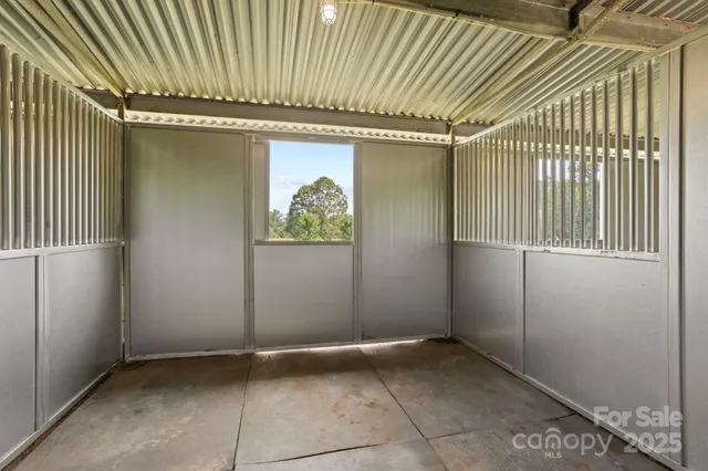 a dining room with furniture a chandelier and wooden floor