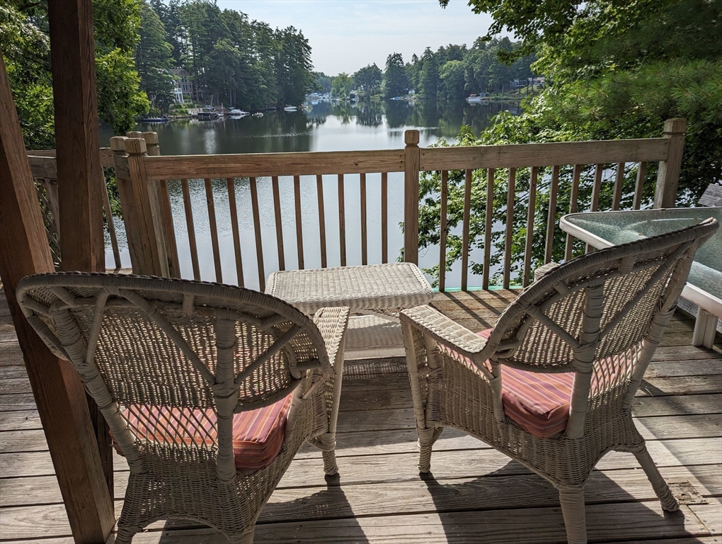 113 Hunter Avenue Hudson, MA 01749 - Photo 11 of 16 a view of a chair in wooden deck