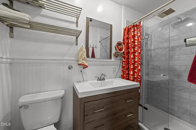 a bathroom with a sink toilet and shower