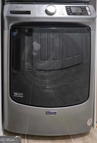 a utility room with washing machine