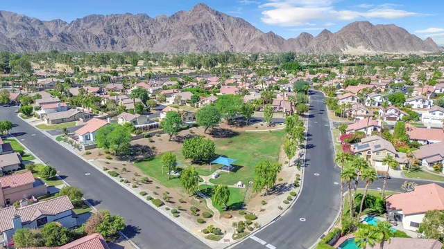 an aerial view of residential houses and outdoor space