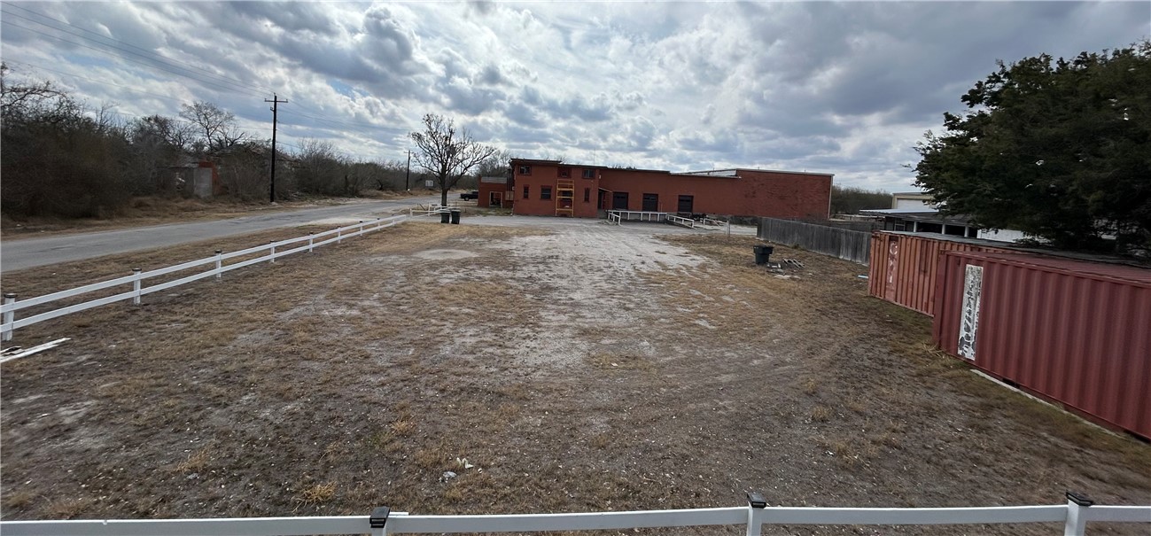 Tba 2 Esperanza Street Alice, TX 78332 - Photo 5 of 6 a view of a dry yard with wooden fence