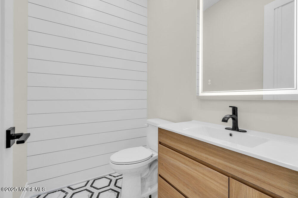 1730 Old Freehold Road Toms River, NJ 08755 - Photo 13 of 31 a bathroom with a sink a toilet and mirror
