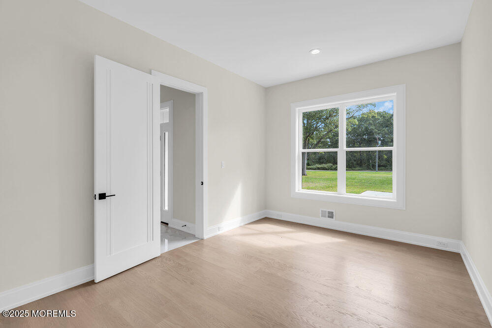 1730 Old Freehold Road Toms River, NJ 08755 - Photo 14 of 31 an empty room with windows and closet