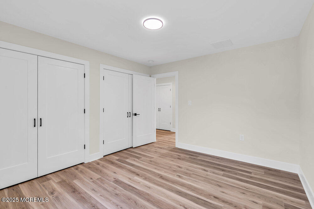 1730 Old Freehold Road Toms River, NJ 08755 - Photo 19 of 31 a view of an empty room with wooden floor