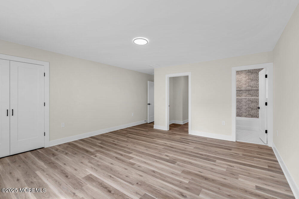 1730 Old Freehold Road Toms River, NJ 08755 - Photo 23 of 31 a view of an empty room with wooden floor
