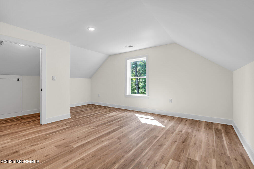 1730 Old Freehold Road Toms River, NJ 08755 - Photo 27 of 31 an empty room with wooden floor and windows