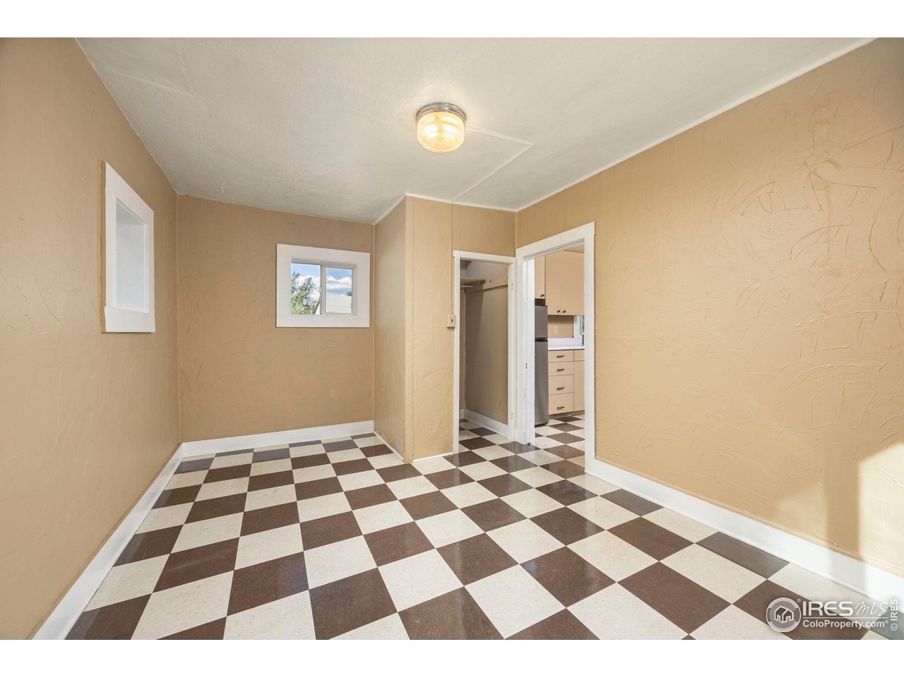 1623 12th Street Greeley, CO 80631 - Photo 29 of 30 a black and white checkered floor with a black white checkered floor