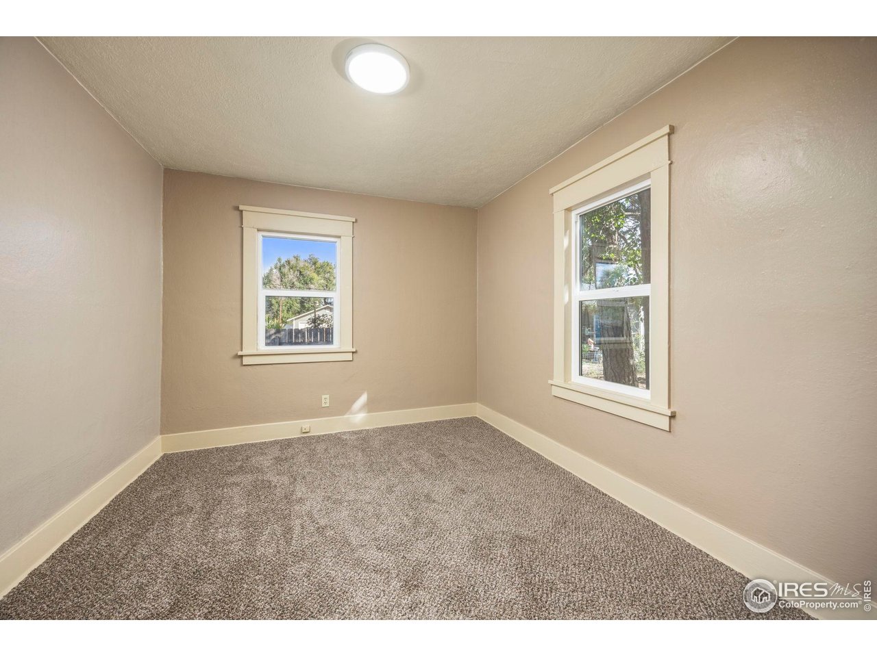 1623 12th Street Greeley, CO 80631 - Photo 8 of 30 an empty room with windows