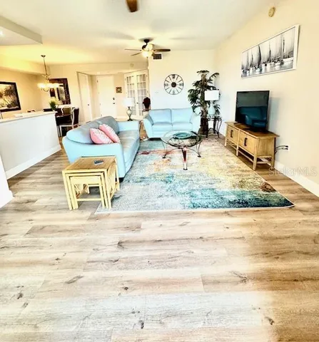a kitchen with stainless steel appliances a refrigerator sink and cabinets