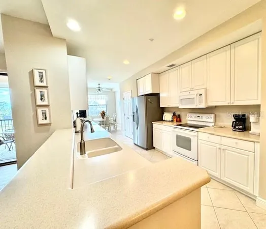 a dining room with furniture and a window