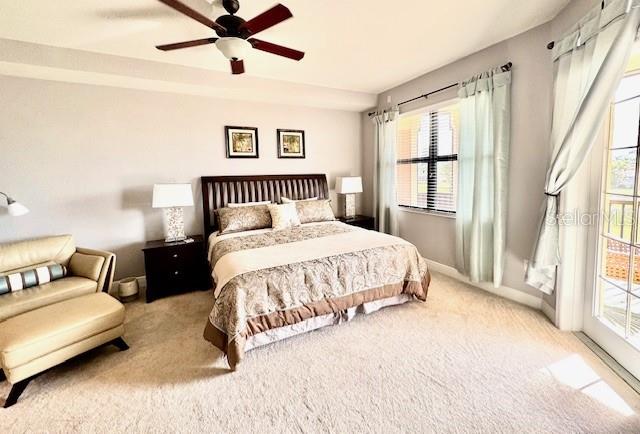 24417 Baltic Avenue, Unit 1102 Punta Gorda, FL 33955 - Photo 23 of 53 a bedroom with a large bed and a couch