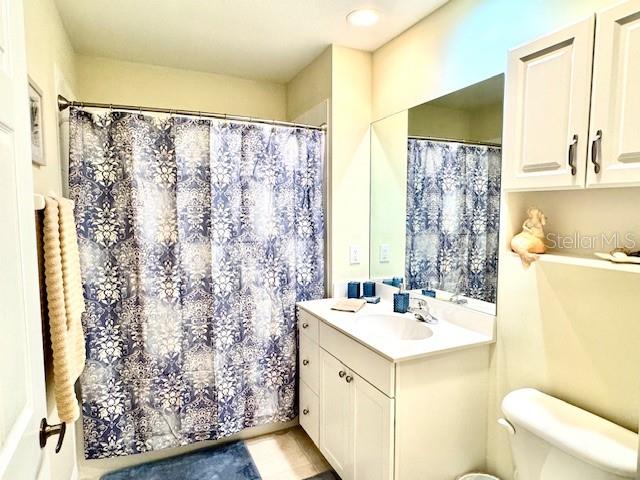 24417 Baltic Avenue, Unit 1102 Punta Gorda, FL 33955 - Photo 27 of 53 a bathroom with a sink and a mirror