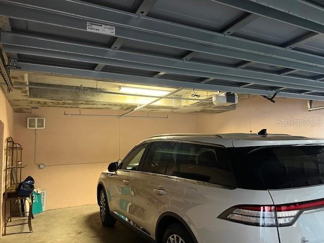 24417 Baltic Avenue, Unit 1102 Punta Gorda, FL 33955 - Photo 29 of 53 a car parked in a garage