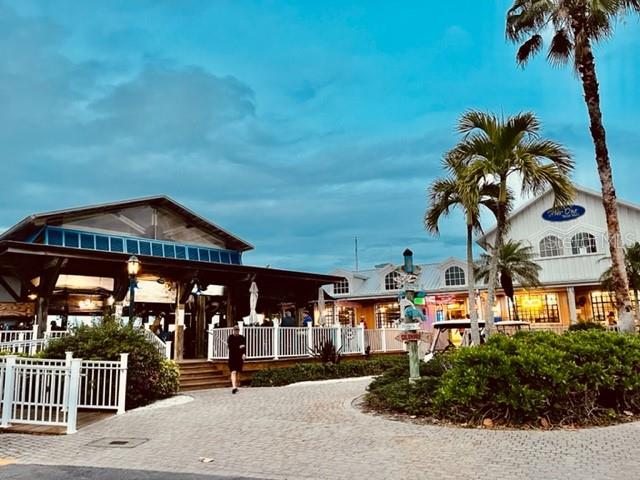 24417 Baltic Avenue, Unit 1102 Punta Gorda, FL 33955 - Photo 31 of 53 an outdoor space with wooden benches