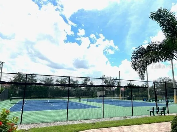 a view of an outdoor space and tennis court