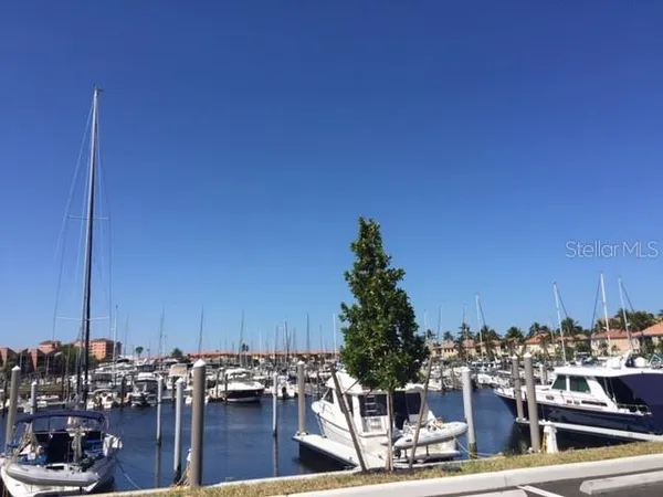 a couple of table and a chair in front of a house